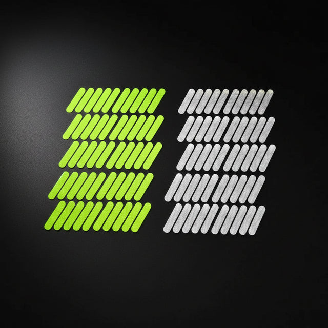 Two sets of 50 adhesive hook-and-loop fastening strips, with one set in bright neon yellow-green and the other in translucent white, under the text '100 PCS' in red at the top.